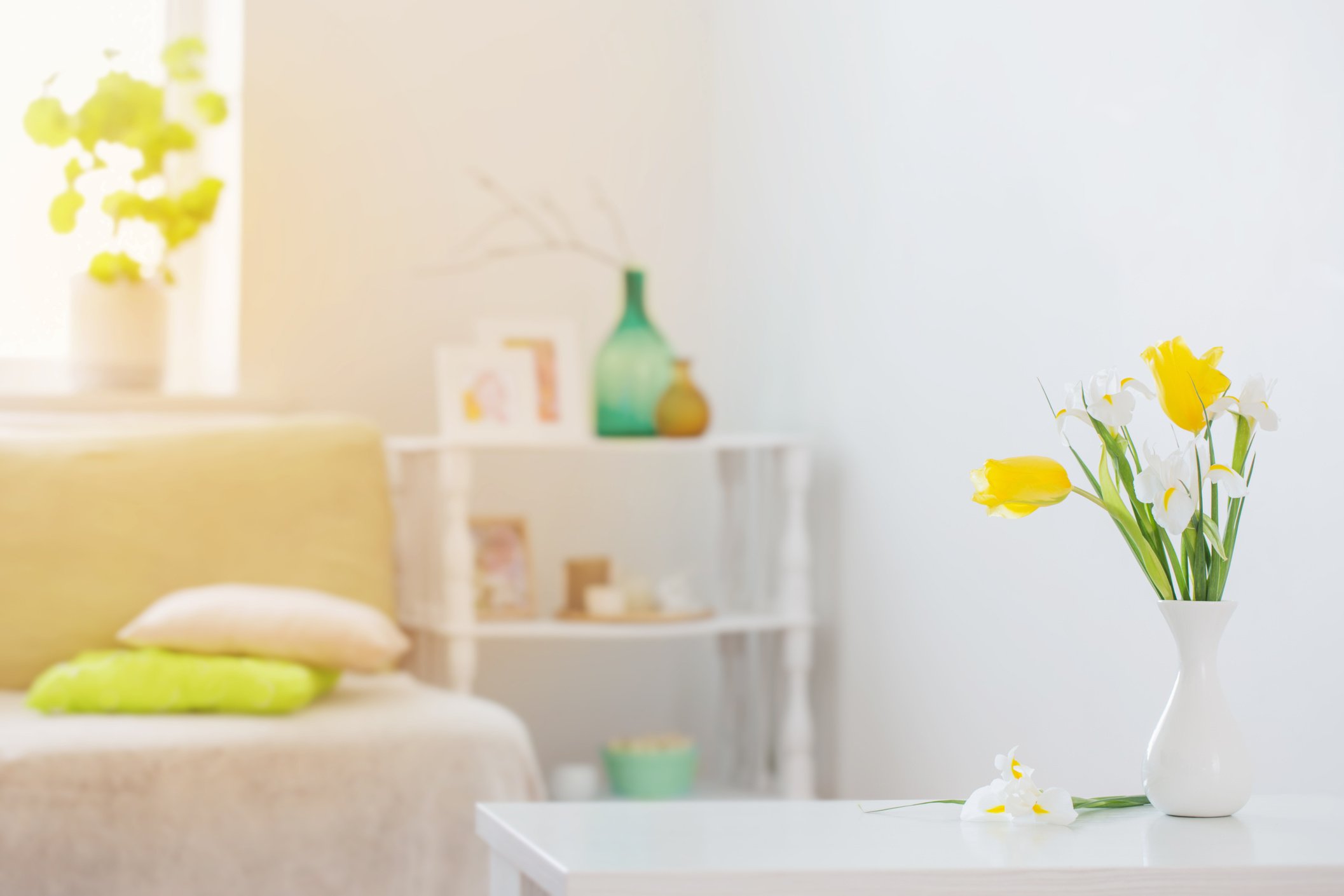 white home interior with spring flowers and decorations